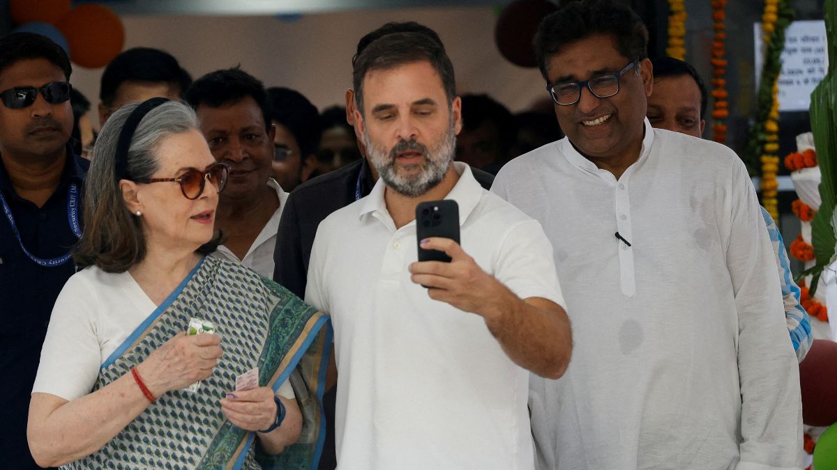 Rahul Gandhi and Sonia Gandhi, senior leaders of the Congress party, take a selfie at a polling station during the sixth phase of the general election, in New Delhi, 25 May, 2024. File Image/Reuters